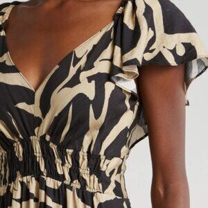 Mello Day smocked maxi dress with open back.